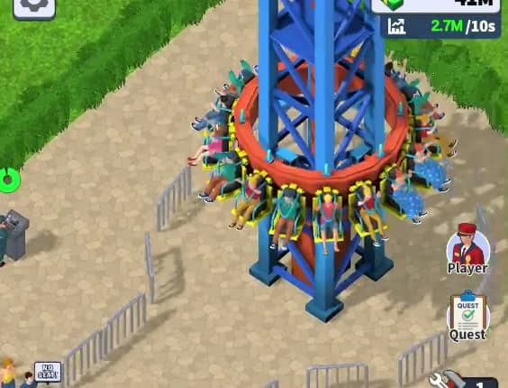 Close-up of the drop tower's seat ring in Theme Park Manager: sixteen seats around the ring, each with a rider, restraints down and legs hanging, all clearly readable from the overhead camera angle